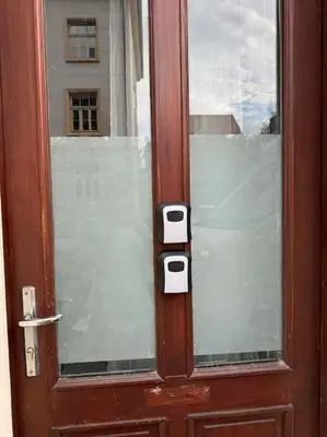 a wooden door with two locks on a window at Beerpartment with parking in Ljubljana