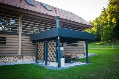 a gazebo in front of a building at Hayrack Skok Mozirje in Mozirje