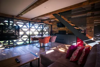 a living room with a couch and a table at Hayrack Skok Mozirje in Mozirje