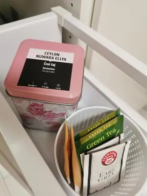 a shelf in a refrigerator with a container of food at Apartment Studio MY RESIDENCE in the city center in Ljubljana