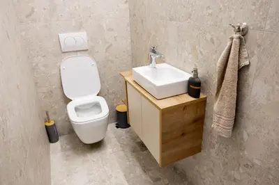 a bathroom with a white toilet and a sink at Prosecco apartment in Bovec