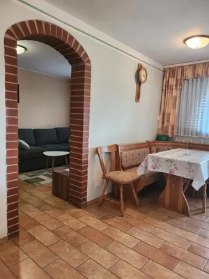 a living room with a couch and a table at Hiša Heidi in Zavrč