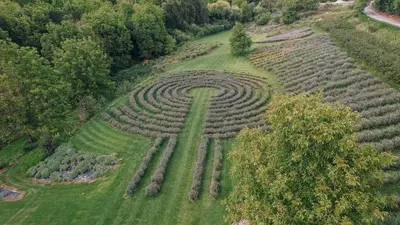 an aerial view of a large circular maze in a field at Štajerska sivka - Jacuzzi & Savna in Maribor