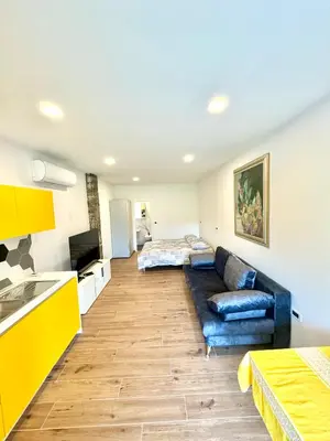 a living room with a couch and a bed at Apilandia Nanos in Vipava