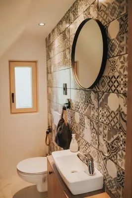 a bathroom with a sink and a mirror at Riverside House Krka in Zagradec