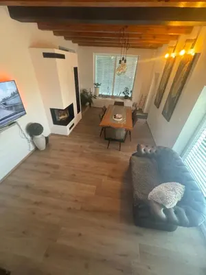 a living room with a couch and a table at Hiška pri brajdah in Videm pri Ptuju