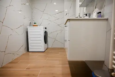 a small kitchen with a sink and a white cabinet at Apartma Cave Bliss Maribor in Maribor
