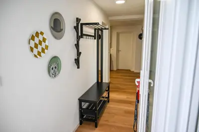 a room with a wall with skis on the wall at Apartma Cave Bliss Maribor in Maribor