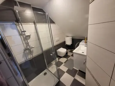a bathroom with a shower and a toilet at Jack apartments in Maribor