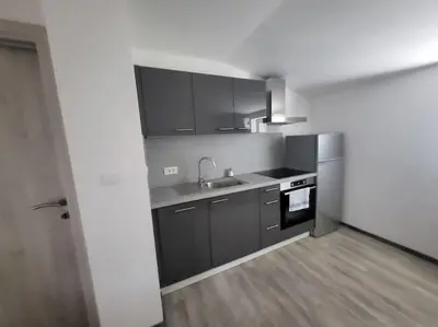 a kitchen with a sink and a stove at Jack apartments in Maribor
