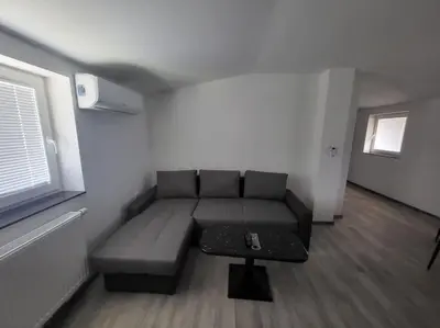 a living room with a couch and a table at Jack apartments in Maribor