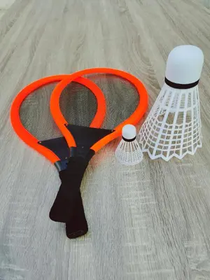 an orange and black tennis racket and a white object at Dream home apartment in Koper