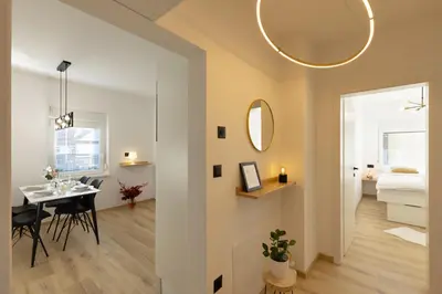 a small apartment with a dining room and a bedroom at Apartments Lia in Ljubljana