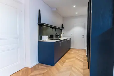 a kitchen with a blue island in a room at Villa Elizabeth - Family Apartment for 6 in Slovenj Gradec
