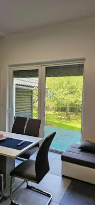 a room with a table and chairs and a window at Apartma Marija in Kranjska Gora