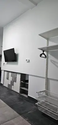 a room with a wall with a tv on it at Apartma Marija in Kranjska Gora