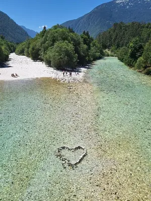 a heart drawn in the water on a beach at Apartment Loft Pejić - open space loft studio near Bovec, Soča Valley in Bovec