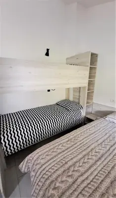a desk in a room with a bed next to a desk at Studio Sofia in Rakek