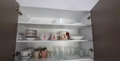 a cupboard filled with lots of glass items at Studio Sofia in Rakek