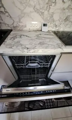 an oven with its door open on a counter at Studio Sofia in Rakek