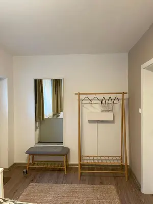 a dressing room with a mirror and a bench at The BeeHouse, Nature stay in Šempeter v Savinjski Dolini