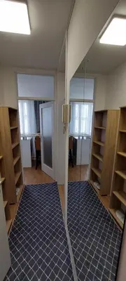 a room with a mirror and a room with shelves at URBAN HARMONY APARTMENT Maribor in Maribor
