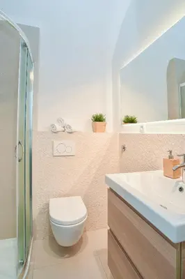 a bathroom with a toilet and a sink at Ljubljana Center Apartments in Ljubljana