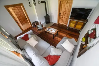 an overhead view of a living room with a couch at Cozy Alpine House in Gozd Martuljek