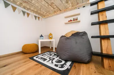 a room with a black bag on the floor at Cozy Alpine House in Gozd Martuljek