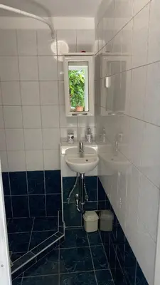 a bathroom with a sink and a window at Semper Liberi in Maribor