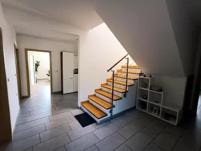 a staircase in a room with a stair case at Počitniška hiša Kapitanovše in Ajdovščina