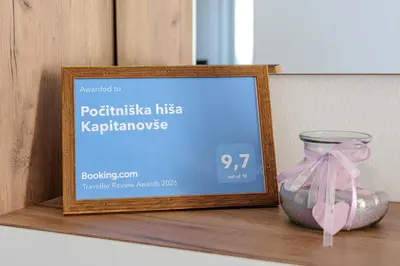 a sign sitting on a shelf next to a glass jar at Počitniška hiša Kapitanovše in Ajdovščina