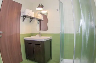 a bathroom with a sink and a shower at Apartments Helena Kranjska Gora in Kranjska Gora