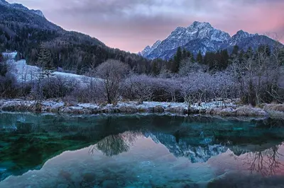 a view of a lake with mountains in the background at Apartments Helena Kranjska Gora in Kranjska Gora