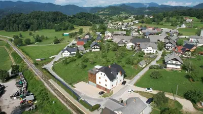 an aerial view of a small village with houses at Aparthotel Hom at Vintgar in Zgornje Gorje