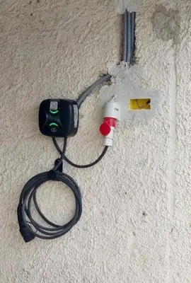 a camera attached to a wall with a cord at Aparthotel Hom at Vintgar in Zgornje Gorje