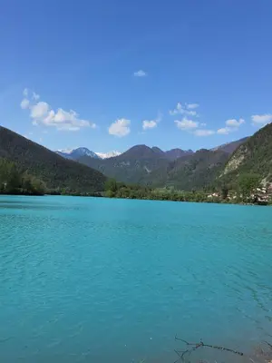 a view of a lake with mountains in the background at Apartma PRI ŠTAJERKI in Most na Soči