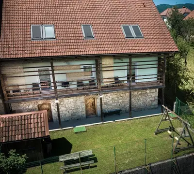 an aerial view of a house with a roof at Apartments Šuster in Stari Trg ob Kolpi