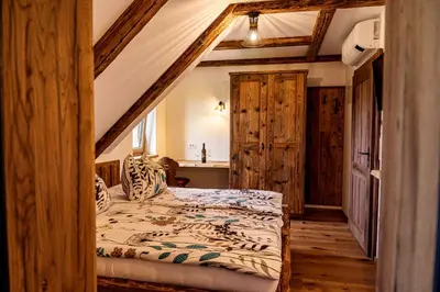 a bedroom with a bed in a room at Rooms Dreisiebner at the Heart in Zgornja Kungota