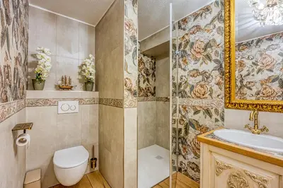 a bathroom with a toilet and a sink at Royal Garden in Škofja Loka