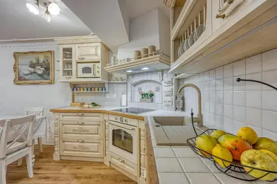 a kitchen with a bowl of fruit on the floor at Royal Garden in Škofja Loka