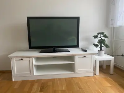 a tv sitting on top of a white entertainment center at Apartma Tatjana in Žirovnica
