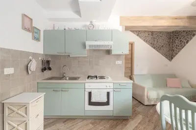 a small kitchen with a sink and a stove at Apartma Bohinj in Bohinj