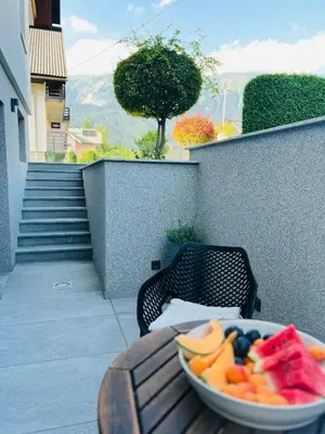 a bowl of fruit sitting on a table on a balcony at Apartma Neja in Žirovnica