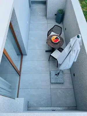 an overhead view of a patio with a table and chairs at Apartma Neja in Žirovnica