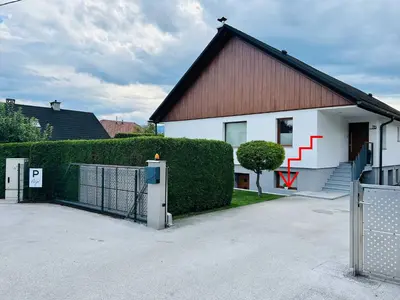 a house with a gate in front of it at Apartma Neja in Žirovnica