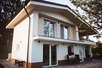 a small house with a lot of windows at Holiday Home Vinagora in Bistrica ob Sotli