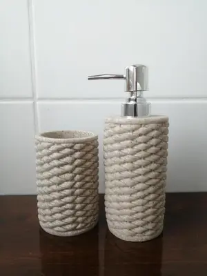 two baskets sitting on a table next to a faucet at Silentium Domus doo in Gornje Vreme