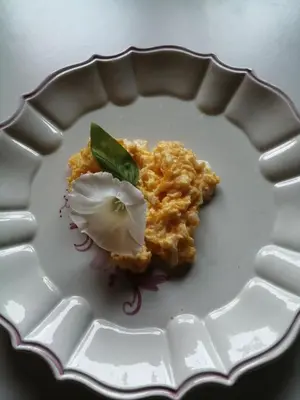 a white plate with a food item on it at Silentium Domus doo in Gornje Vreme