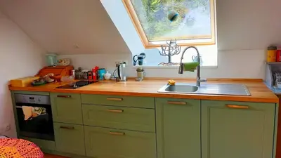 a small kitchen with a sink and a window at Pr Trnovc in Preddvor